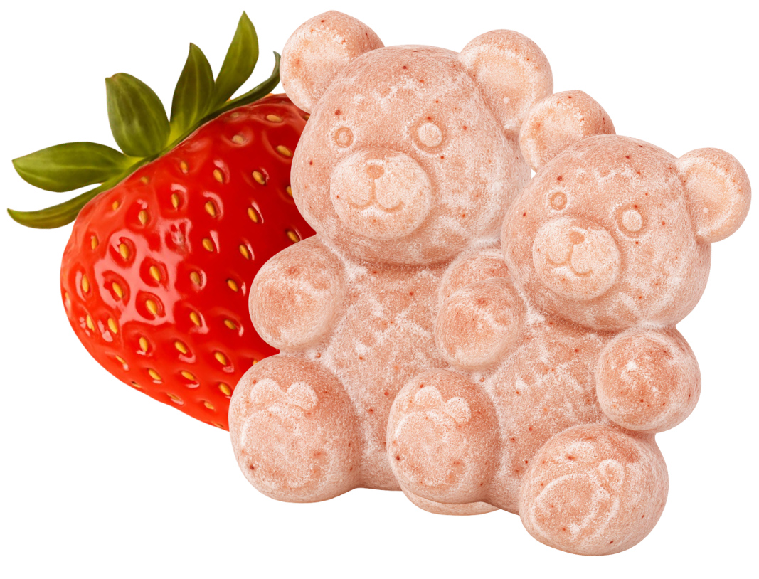 Tabletki Colostrum Kids w kształcie misiów obok truskawek